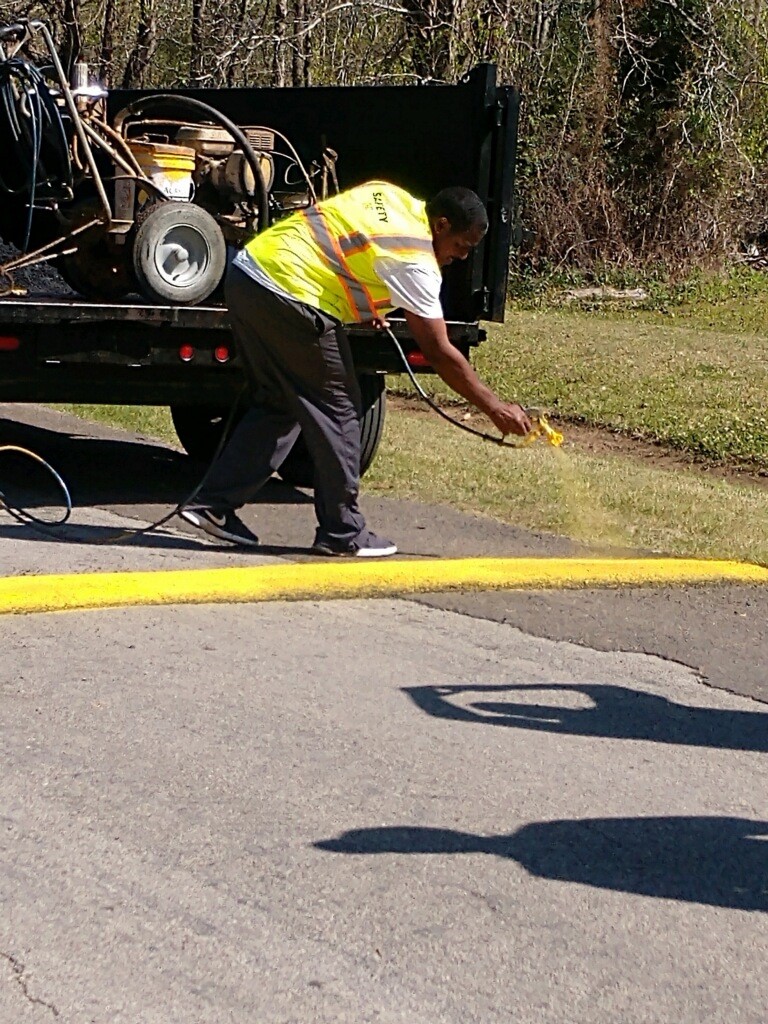 mayor spraying speed bump